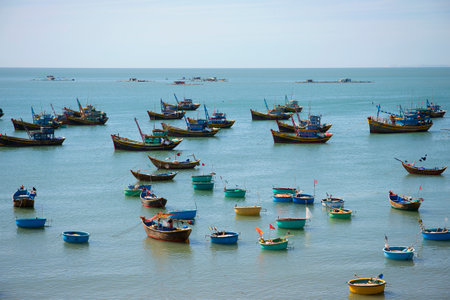 MUI NE, VIETNAM - DECEMBER 25, 2015: The South China sea covered with fishing boats. The fishing harbour of Mui Neのeditorial素材