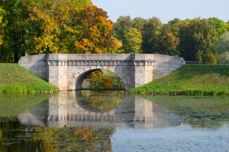 The Karpin bridge closeup sunny september day. Gatchina Palace Park. Leningrad region, Russiaのeditorial素材