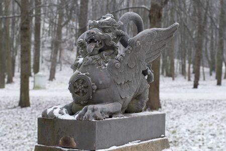 The sculpture of the dragon on the bridge closeup gloomy winter day. Tsarskoye Selo, Russiaの写真素材
