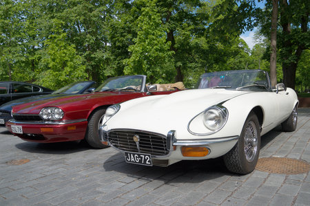 TURKU, FINLAND - JUNE 13, 2015: White Jaguar E XKE Series 3 and red Jaguar XJ-S (XJS) on the parade car brand "Jaguar"のeditorial素材
