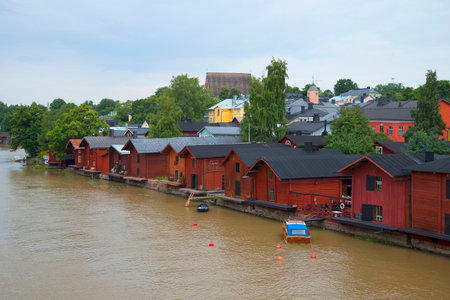 PORVOO, FINLAND - AUGUST 17, 2013: View of the old warehouses in Porvoo cloud by day. Finlandのeditorial素材