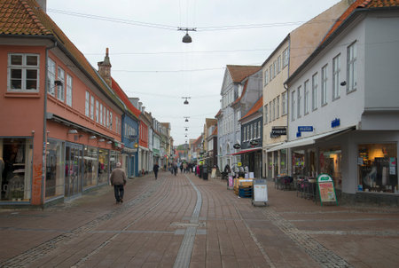 HELSINGOR, DENMARK - NOVEMBER 02, 2014: A cloudy november day in Helsingor. Tourists walk around the...