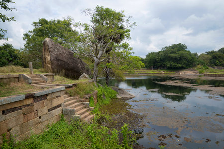 The ruins of the ancient Buddhist monastery Rajagiri Kanda near a Pond of Black Water. Mihintale, Sri Lankaのeditorial素材