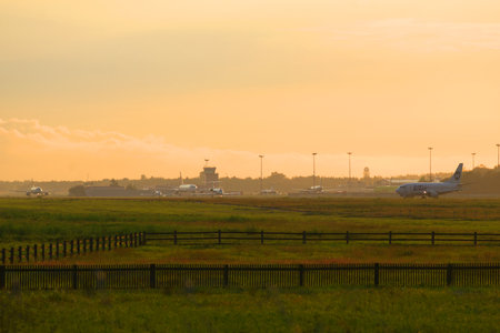 SAINT PETERSBURG, RUSSIA - JULY 03, 2016: The plane is on the tarmac of Pulkovo airport, the july eveningのeditorial素材
