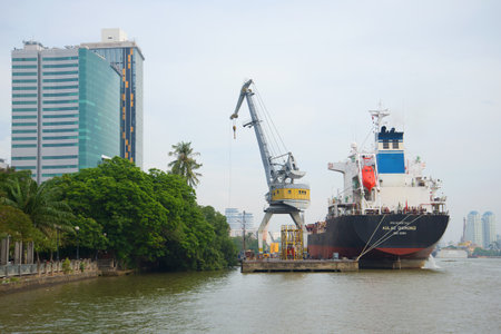 HO CHI MINH CITY, VIETNAM - DECEMBER 19, 2015: A cargo ship at the city pier on a cloudy dayのeditorial素材