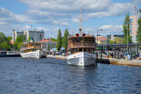 SAVONLINNA, FINLAND - JUNE 06, 2015: Two vintage steamer on lake Saimaa. Savonlinna, Finlandのeditorial素材
