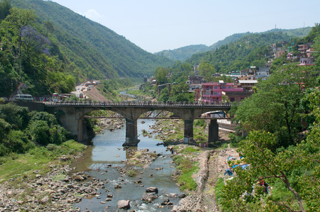 Road bridge over the river in the city of Saket Mandi. Himachal Pradesh, India