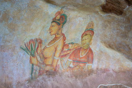 SIGIRIYA, SRI LANKA - MARCH 16, 2015: Ancient fresco with the image of imperial concubines on a wall of the mountain palace Sigiriya. The historical landmark of the Sri Lankaのeditorial素材