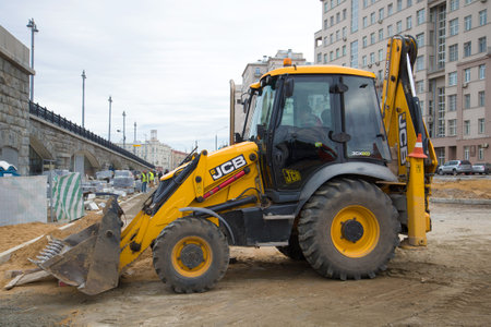 MOSCOW, RUSSIA - SEPTEMBER 07, 2016: The JCB-3CX excavator loader on reconstruction of an automobile...