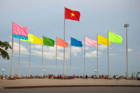 VUNG TAU, VIETNAM - DECEMBER 21, 2015: Fragment of the city's waterfront with the national state flag of Vietnamのeditorial素材