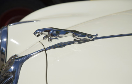 SAVONLINNA, FINLAND - JUNE 06, 2015: The leaping Jaguar is the symbol of the brand on the hood of the car Jaguar Mk I (1957), the Parade of vintage cars in Savonlinna, Finlandのeditorial素材