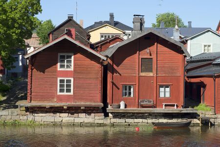 PORVOO, FINLAND - JUNE 13, 2015: A view of summer cafe on the river bank of Porvoyoki in the old cityのeditorial素材