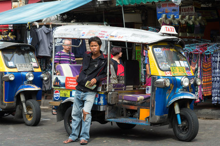 BANGKOK, THAILAND - JANUARY 06, 2017: The driver of a tuk-tuk waiting for passengersのeditorial素材