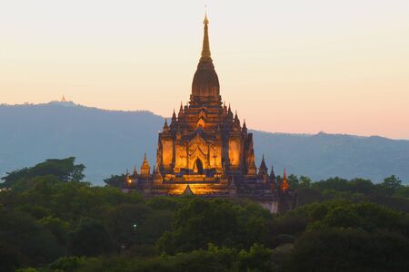 Top of the ancient Buddhist temple of Gawdaw Palin in evening twilight. Bagan, Myanmarの写真素材
