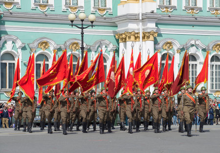 SAINT PETERSBURG, RUSSIA - MAY 05, 2015: Soldiers with flags on the Palace square. Rehearsal of parade in honor of Victory Day in St. Petersburgのeditorial素材