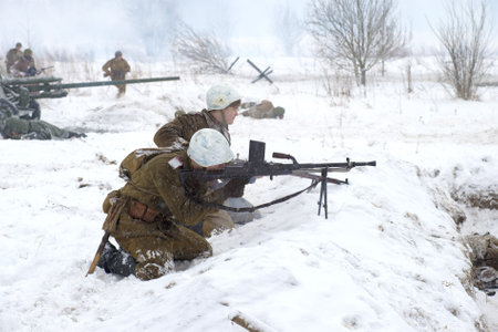 SAINT PETERSBURG, RUSSIA - JANUARY 15, 2017: the Soviet machine gunners with a machine gun in battle. A fragment of the military-historical festival for the release of the Krasnoe Selo. Operation "January thunder"のeditorial素材