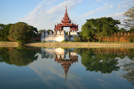 An ancient bastion of the old city with a reflection in the evening light. Mandalay, Burmaの写真素材