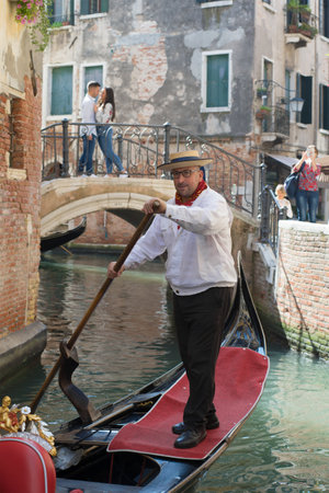 VENICE, ITALY - SEPTEMBER 28, 2017: Venetian gondolier close-up on a city canalのeditorial素材