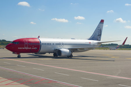 MILAN, ITALY-SEPTEMBER 17, 2017: Norwegian Air Shuttle Boeing 737-8JP (LN-DYD) with Hans Christian Andersen's portrait on the taxiway of Malpensa Airportのeditorial素材
