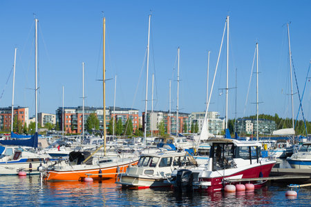 LAPPEENRANTA, FINLAND - JUNE 04, 2017: A big marine on the Saimaa lake a background of modern residential housesのeditorial素材