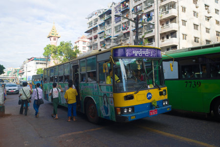 YANGON, MYANMA - DECEMBER 17, 2016: Municipal shuttle bus in the city streetのeditorial素材