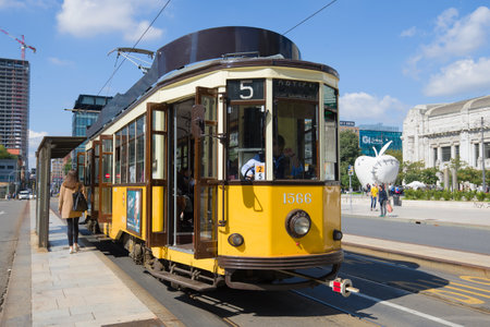 MILAN, ITALY - SEPTEMBER 17, 2017: Old retro the tram at a stop of public transport in the sunny dayのeditorial素材