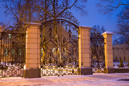 The ancient wrought-iron gates of the palace of Grand Duke Alexander Mikhailovich in the January eveningのeditorial素材