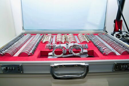 Case with a universal frame an inabor of lenses close up. Set of the doctor-oculist for selection of...