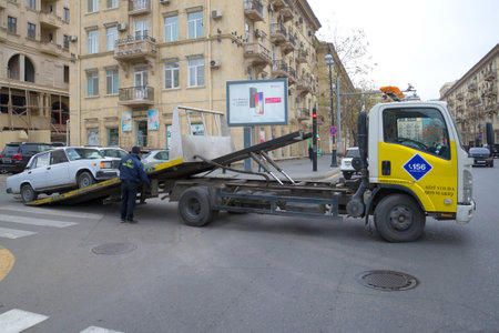 BAKU, AZERBAIJAN - JANUARY 05, 2018: Evacuation of a broken car VAZ-2107 on a city street