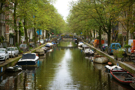 AMSTERDAM, NETHERLANDS - SEPTEMBER 30, 2017: City channel on a cloudy autumn dayのeditorial素材