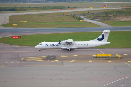 HELSINKI, FINLAND - SEPTEMBER 30, 2017: Passenger twin-engine turboprop ATR 72-500 (OH-ATK) Nordic Regional Airlines on the taxiway of Vantaa Airportのeditorial素材
