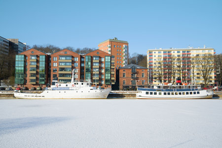 TURKU, FINLAND - FEBRUARY 23, 2018: Two ships hibernate at the city waterfrontのeditorial素材