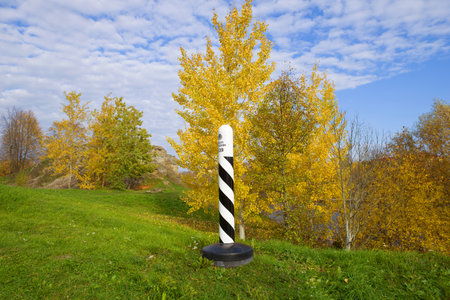 NARVA, ESTONIA - OCTOBER 17, 2018: Estonian border pillar in the autumn landscape. Border of Estonia and Russiaのeditorial素材
