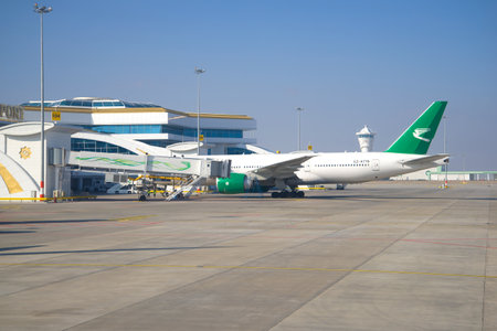 ASHGABAT, TURKMENISTAN - JANUARY 07, 2017: The Boeing 777-200 (EZ-A778) of Turkmenistan Airlines at a telescopic ladder of the international terminal of the airportのeditorial素材