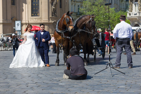 PRAGUE, CZECH REPUBLIC - APRIL 21, 2018: Chinese wedding photo shoot on the Staromestskaya Squareのeditorial素材