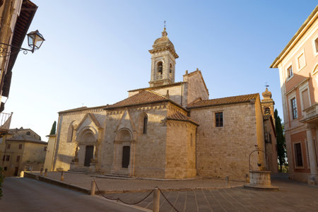 The medieval church of La Collegiata dei Santi Quirico e Juliette in the town of San Quirico d'Orcia on September evening. Italyのeditorial素材