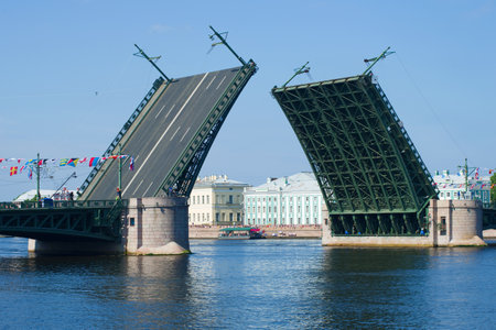 View of the divorced Palace Bridge on a sunny July afternoon. Saint-Petersburg, Russiaのeditorial素材