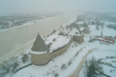 View of the Staraya Ladoga Fortress on a foggy February day (aerial survey). Staraya Ladoga, Russiaのeditorial素材