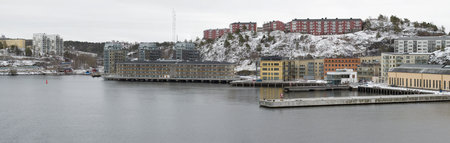 STOCKHOLM, SWEDEN - MARCH 09, 2019: View of modern residential buildings on the shore of the fjord on a gloomy March dayのeditorial素材