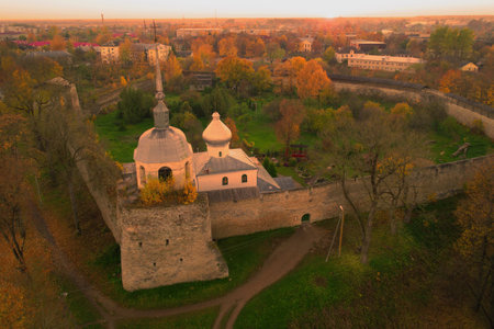 St. Nicholas Cathedral in the fortress in the Indian summer against in the background of the sunset (shooting from a quadrocopter). Porkhov, Russiaのeditorial素材