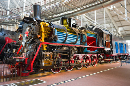 SAINT-PETERSBURG, RUSSIA - AUG. 16, 2018: Old steam locomotive in section. Fragment of the railway...