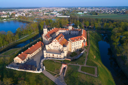 Nesvizh Castle against the background of the cityscape on a May morning. Belarusのeditorial素材