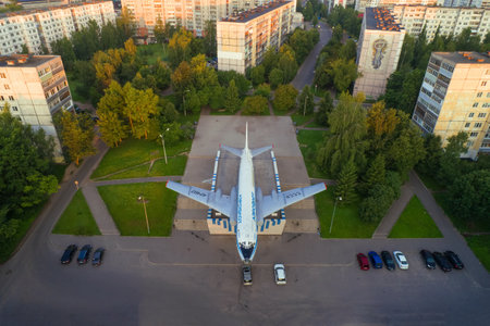 RYBINSK, RUSSIA - JULY 15, 2019: Aircraft Tu-104A - a monument on the street of Motor Builders in a cityscape on a July morning (shooting from a quadrocopter)のeditorial素材