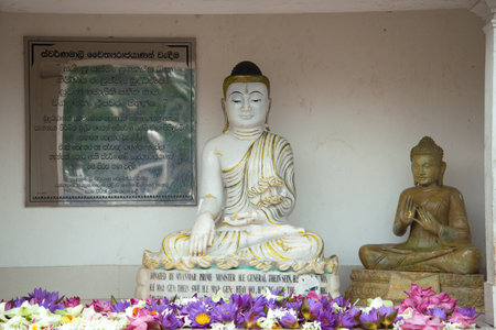 ANURADHAPURA, SRI LANKA - MARCH 12, 2015: Two statues of a sitting Buddha in the sanctuary of...