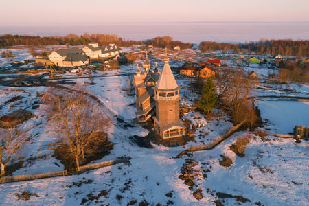Ancient church of Dmitry Solunsky the Myrrh-streaming in the April evening landscape (aerial photography). Village Shcheleiki, Leningrad region, Russiaのeditorial素材