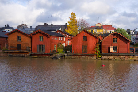 PORVOO, FINLAND - OCTOBER 19, 2019: Old red barns on the banks of the Porvoonjoki River on a cloudy October day. Symbol of old Porvooのeditorial素材