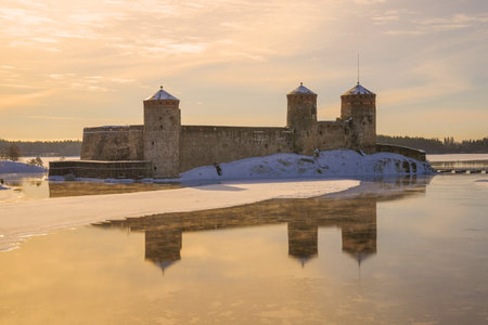 View of the Olavilinna fortress at sunrise on a March morning. Savonlinna, Finlandのeditorial素材