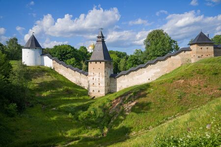 Towers and walls of the Holy Assumption Pskovo-Pechersky Monastery on a sunny June day. Pechory, Russiaの写真素材