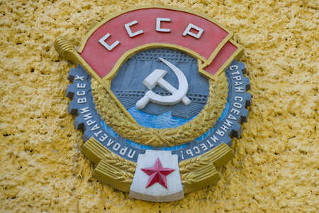 MEDVEZHEGORSK, RUSSIA - AUGUST 17, 2019: Bas-relief of the Order of the Red Banner of Labor on the facade of the building of the administration of the Belomorkanalのeditorial素材