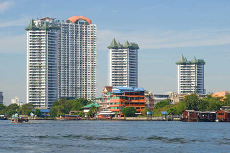 BANGKOK, THAILAND - JANUARY 02, 2019: View of new high-rise apartment buildings on the bank of the Chao Phraya River on a sunny dayのeditorial素材